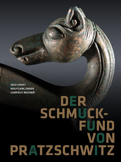 Auf dem Cover unserer Publikation zum Schmuckfund von Pratzschwitz ist ein Ausschnitt der prächtigen Geschichtsfibel zusehen: Der nach links gebogene Kopf eines Wolfes/Hundes.